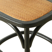 Close-up of the Provincial Cross Back Dining Stool Black, featuring a woven rattan seat and black metal frame, exuding Parisian chic style.