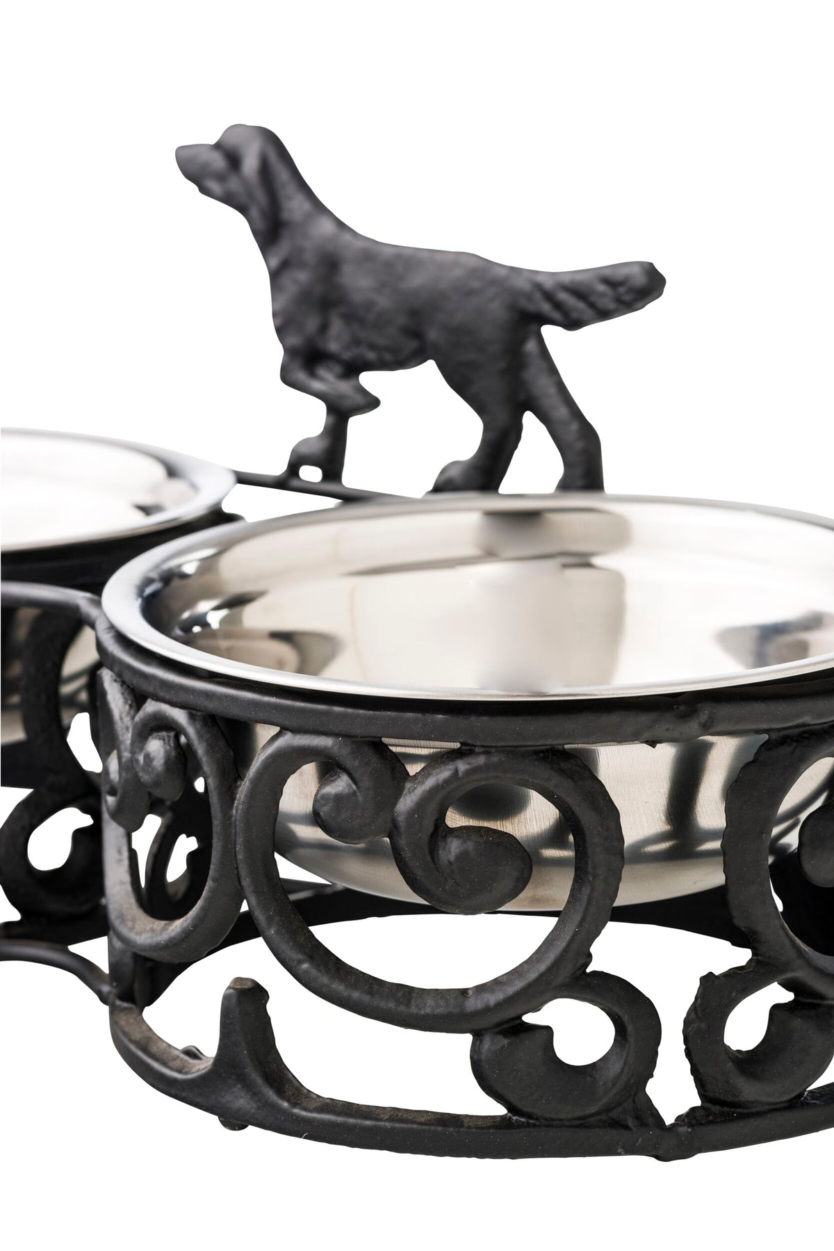 The Double Dog Bowl 35x17cm features a decorative and durable iron holder with two stainless steel bowls, showcasing an antique black and silver finish and adorned with a charming metal dog silhouette on top.