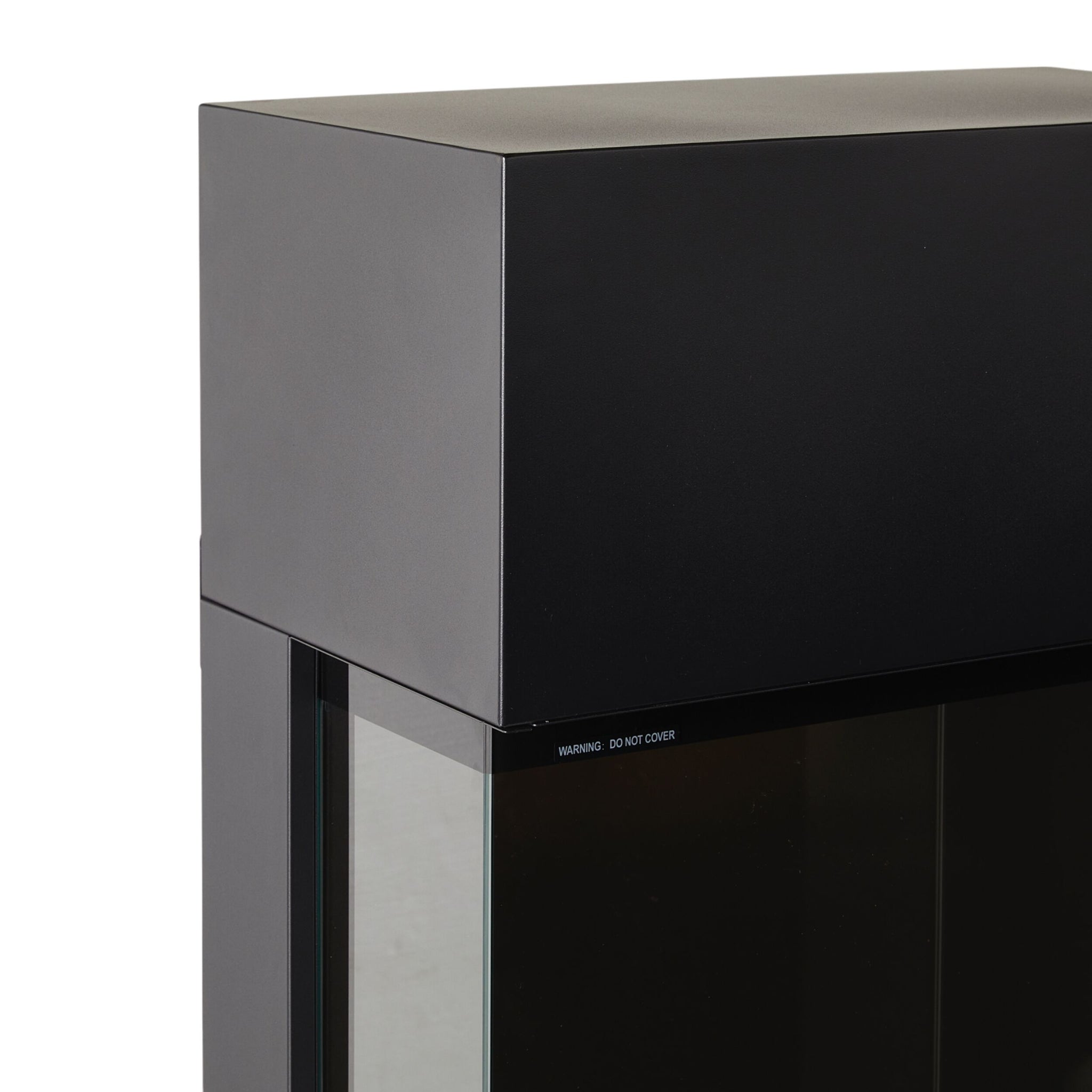 Close-up of the upper corner of a black Nelson Electric Fireplace 61x34x130cm with a matte enclosure and glass front panel.