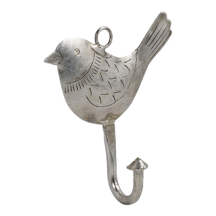 The Ashika Iron Bird Hook is a silver, bird-shaped wall hook with engraved details, a loop on top, and an upward-curving hook at the bottom for added storage.
