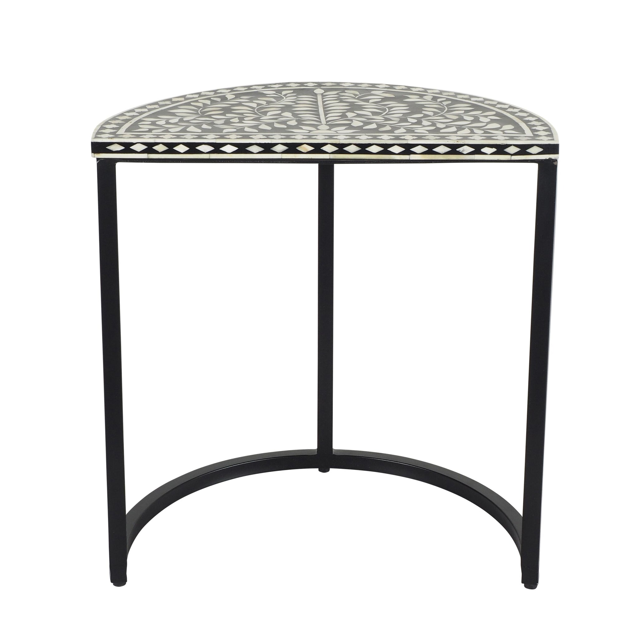 The Bone Inlay Half Moon Side Table Black with Black Frame 44cm is a half-moon shaped black metal side table with a black and white design, featuring intricate geometric patterns that evoke the artistic elegance of bone inlay.