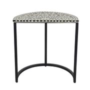 A black and white side table with a decorative top