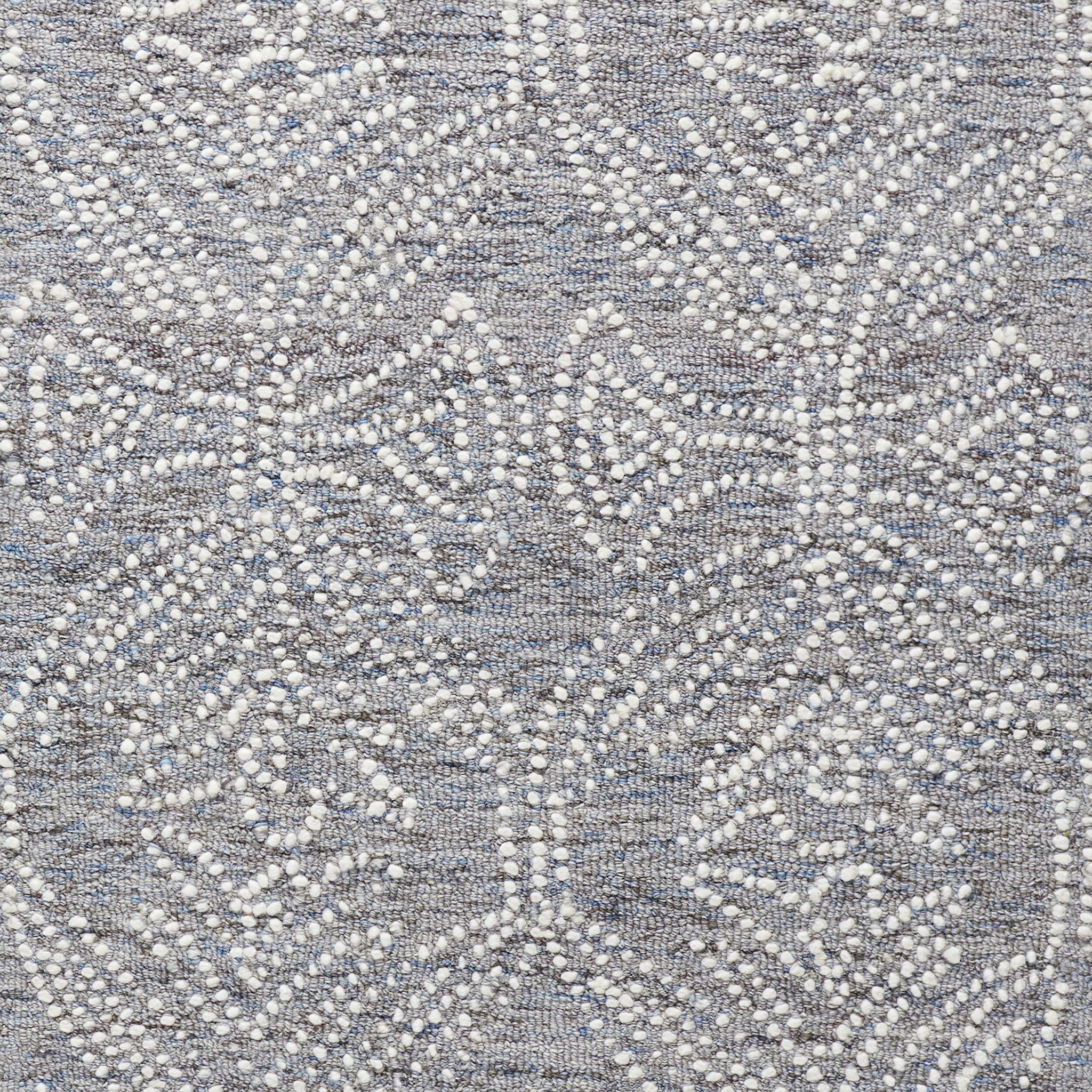 Close-up of the Dreamtime Hand Tufted Wool Grey Rug 300x240cm, featuring a geometric pattern of small white raised dots on a textured grey background—a contemporary piece perfect for modern interiors.