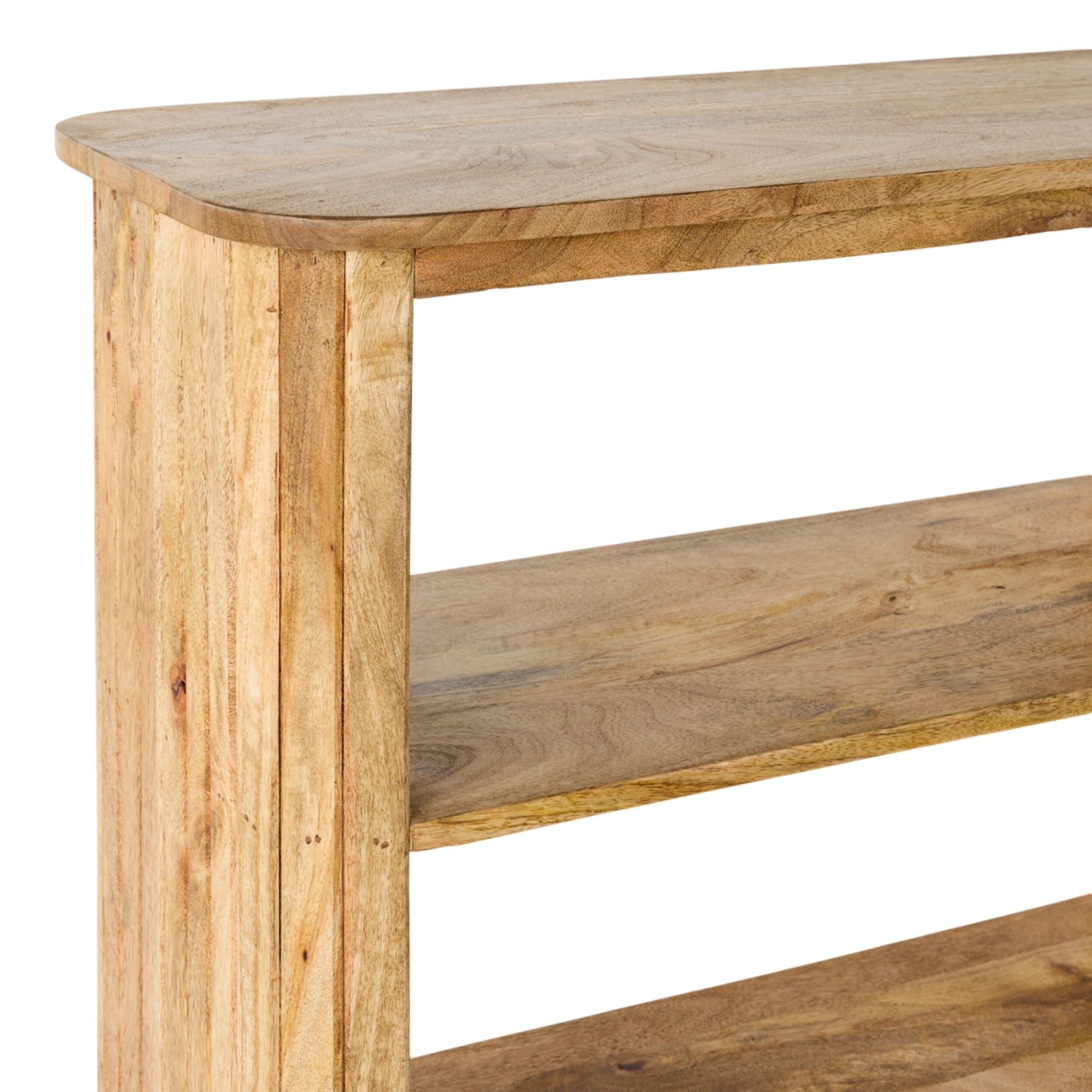 The Brompton Bookcase Low is a three-tiered, open-back bookcase with rounded edges and a natural wood finish, shown from an angle highlighting the side and part of the front.