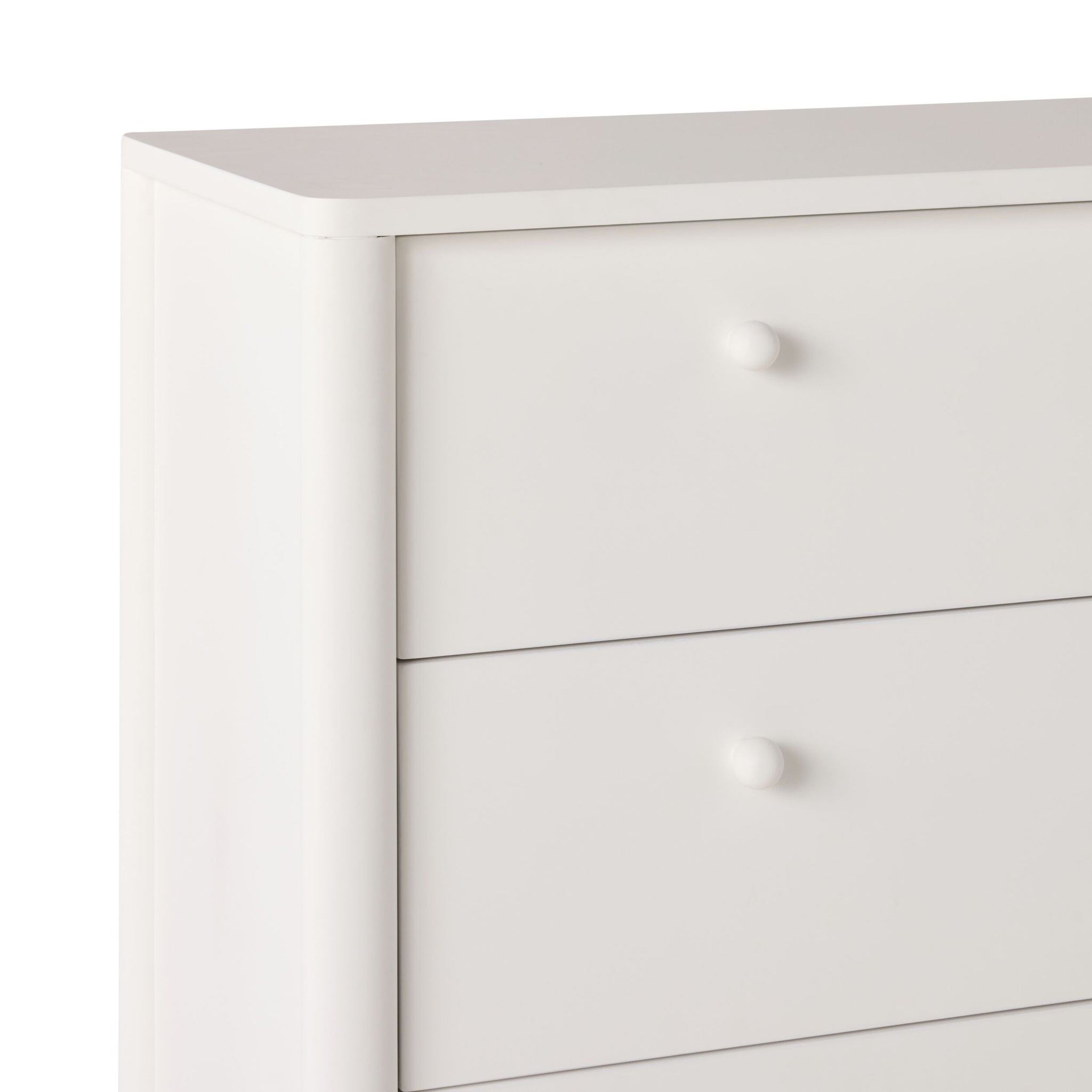 The Spintara 4 Drawer Chest in white features four spacious drawers with round knobs, offering sleek, minimalist bedroom storage; partially shown from the left side.