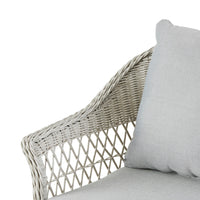 Close-up of a light gray wicker chair from the Catalina 4 Pce Sofa Set, featuring moisture-resistant cushions and a woven armrest design against a white background, ideal for an all-weather outdoor setting.