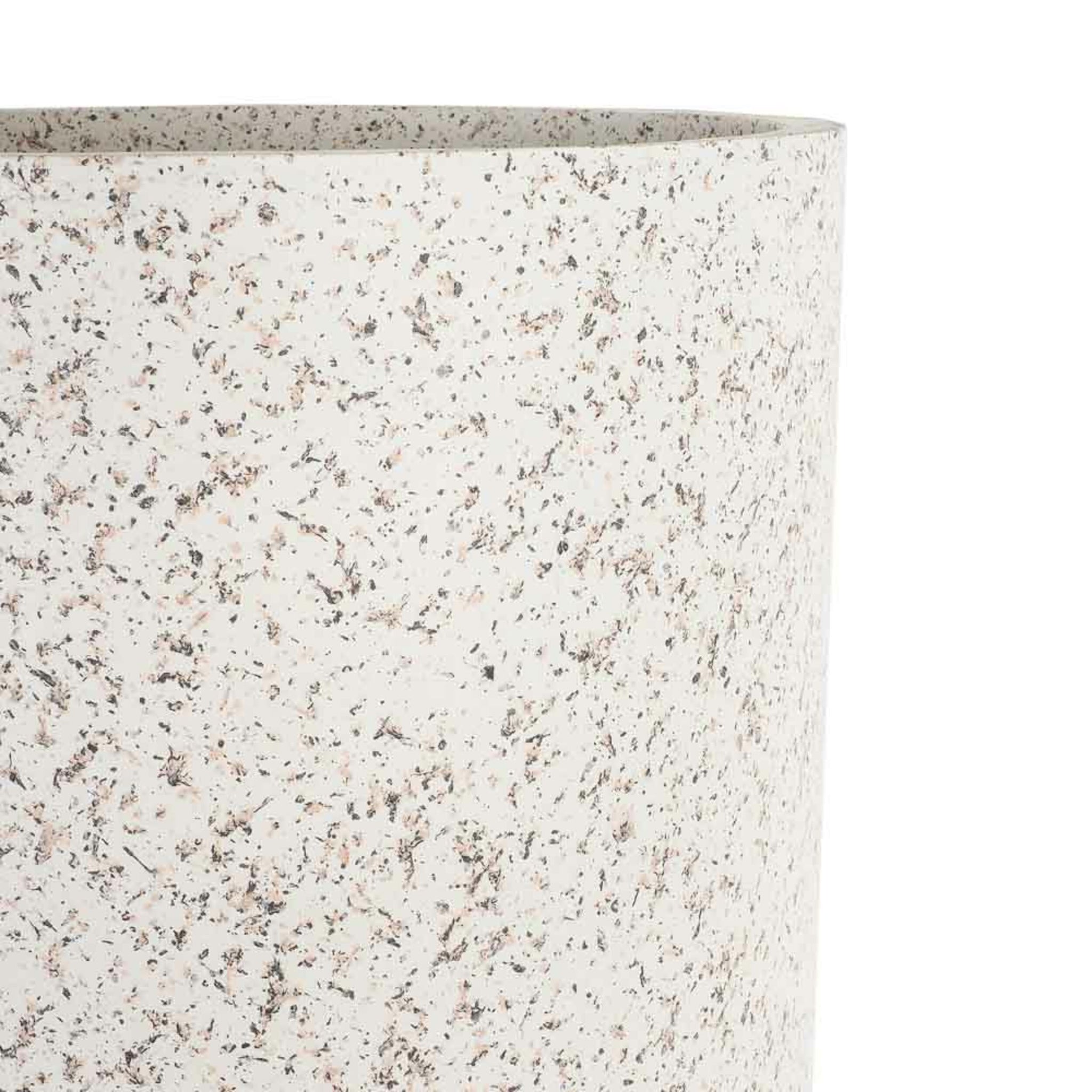 Close-up of a contemporary speckled cylindrical vase with black, grey, and brown speckles on a cream background, offering an earthy alternative to typical decor, like the Terrazzo Look Plant Stand Large 63.5x34cm.