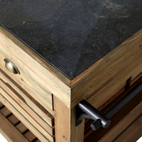 A close-up of the Carter 2 Drawer Island Bench highlights its wooden corner, bluestone top, metal handle, and brass drawer knob, showcasing rustic design details.