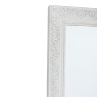 Close-up of the Quincy Antique White Mirror, measuring 90x60cm, featuring an intricate floral pattern on the frame. Angled to the right against a plain background, it exudes timeless style perfect for enhancing home décor.