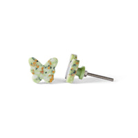 The Speckle Green Butterfly Knob 3.7cm features a green base with multicolored terrazzo speckles; one stands upright, while the other lies on its side, creating a charming decorative drawer pull set.
