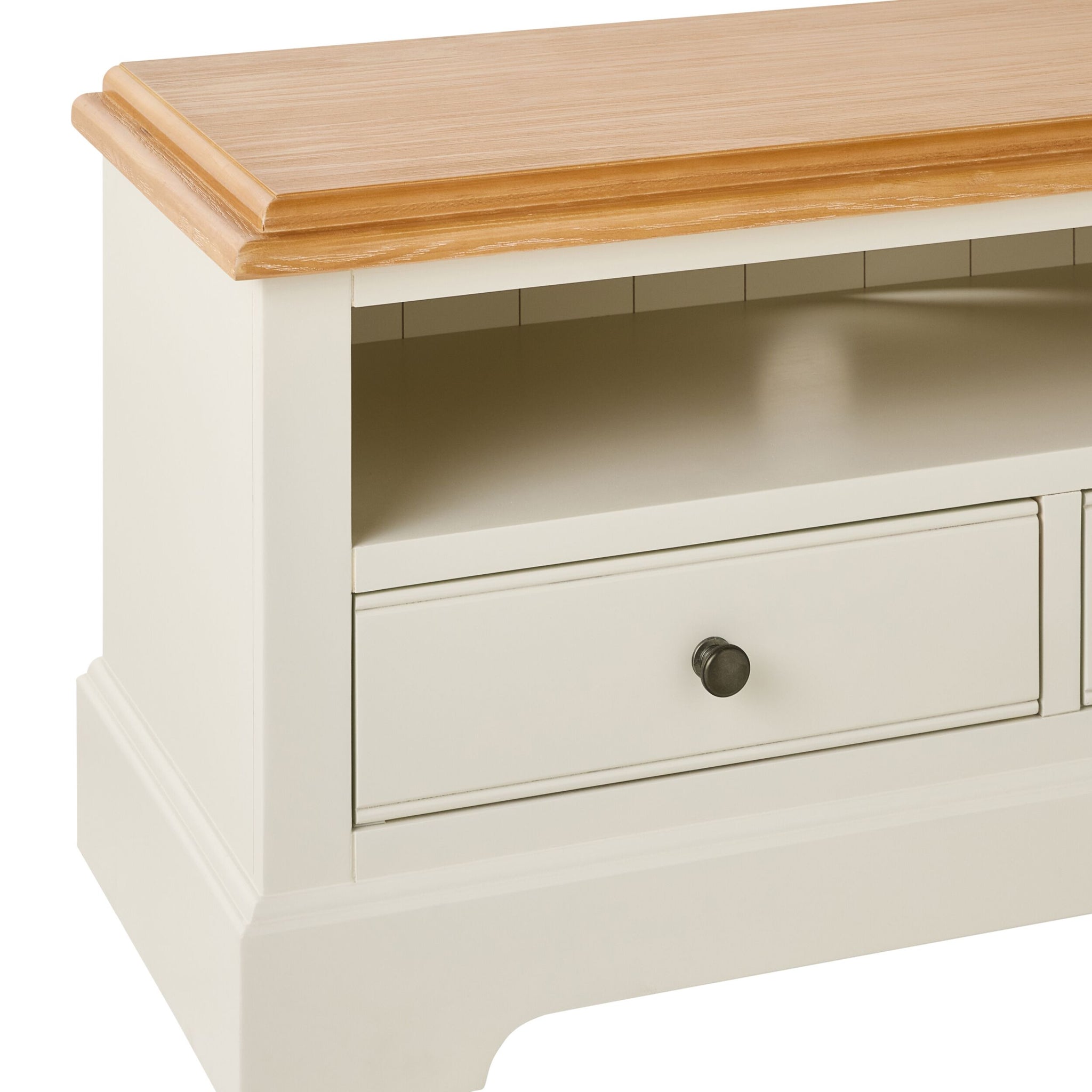 Cream console table with wooden top and single large storage drawer, shown in close-up side angle.