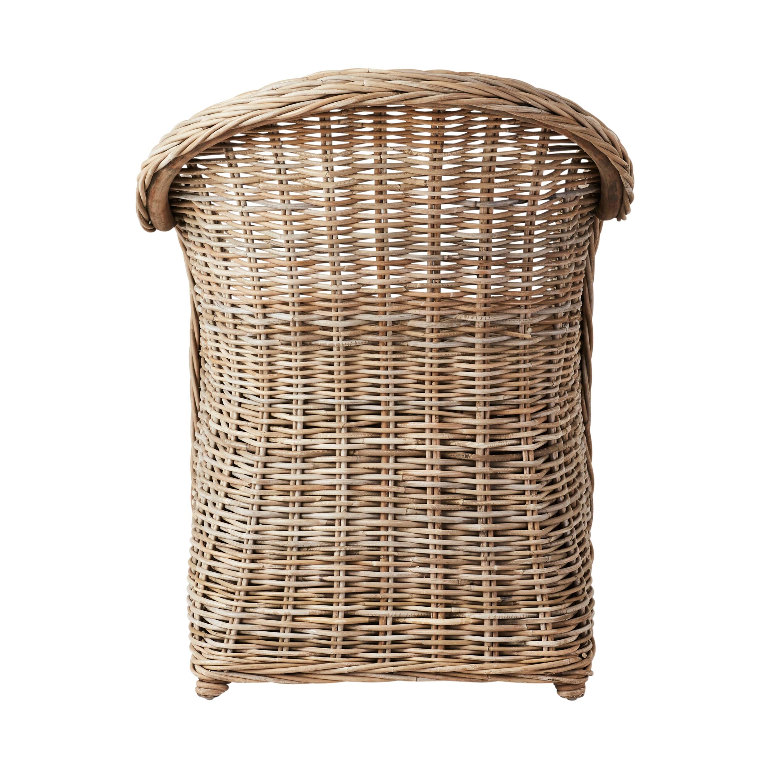 Front view of the Martinique Rattan Armchair with a curved backrest, highlighting its European-inspired design and light brown hue, evoking tropical beauty.