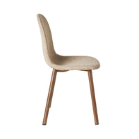 Side view of the Knox Dining Chair Boucle Cream, showcasing a modern cream upholstered seat with a curved backrest and chocolate-toned wood legs.