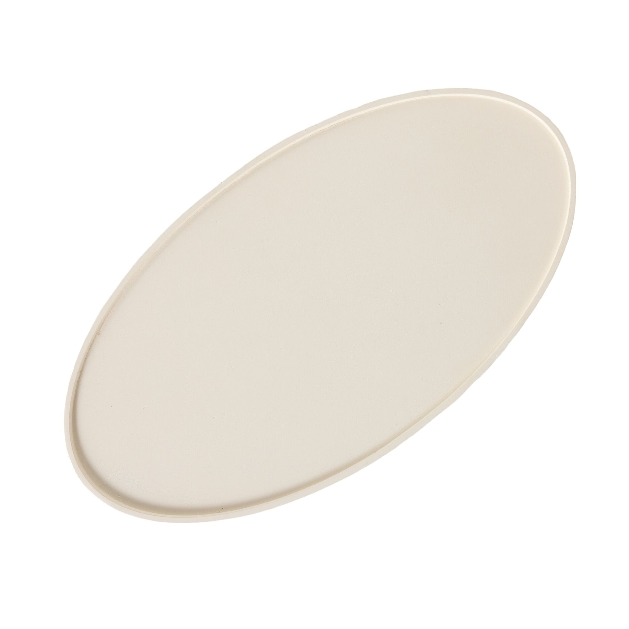 A plain, oval-shaped, off-white ceramic plate is displayed on a white background, evoking the smooth elegance of the Lani Oval Coffee Table White Wash (120 x 39 x 65cm).