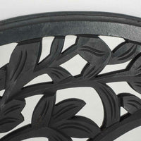 Close-up of the Frieze Tree Of Life Wall Hanging, 90x90cm, showcasing a black metal surface with a leaf pattern.