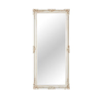 The Jane Mirror Champagne Silver 167x77cm features a tall rectangular shape with an ornate frame adorned with intricate carvings at the corners and edges, showcasing a versatile design. This elegant mirror seamlessly complements any decor setting, exuding a timeless charm.
