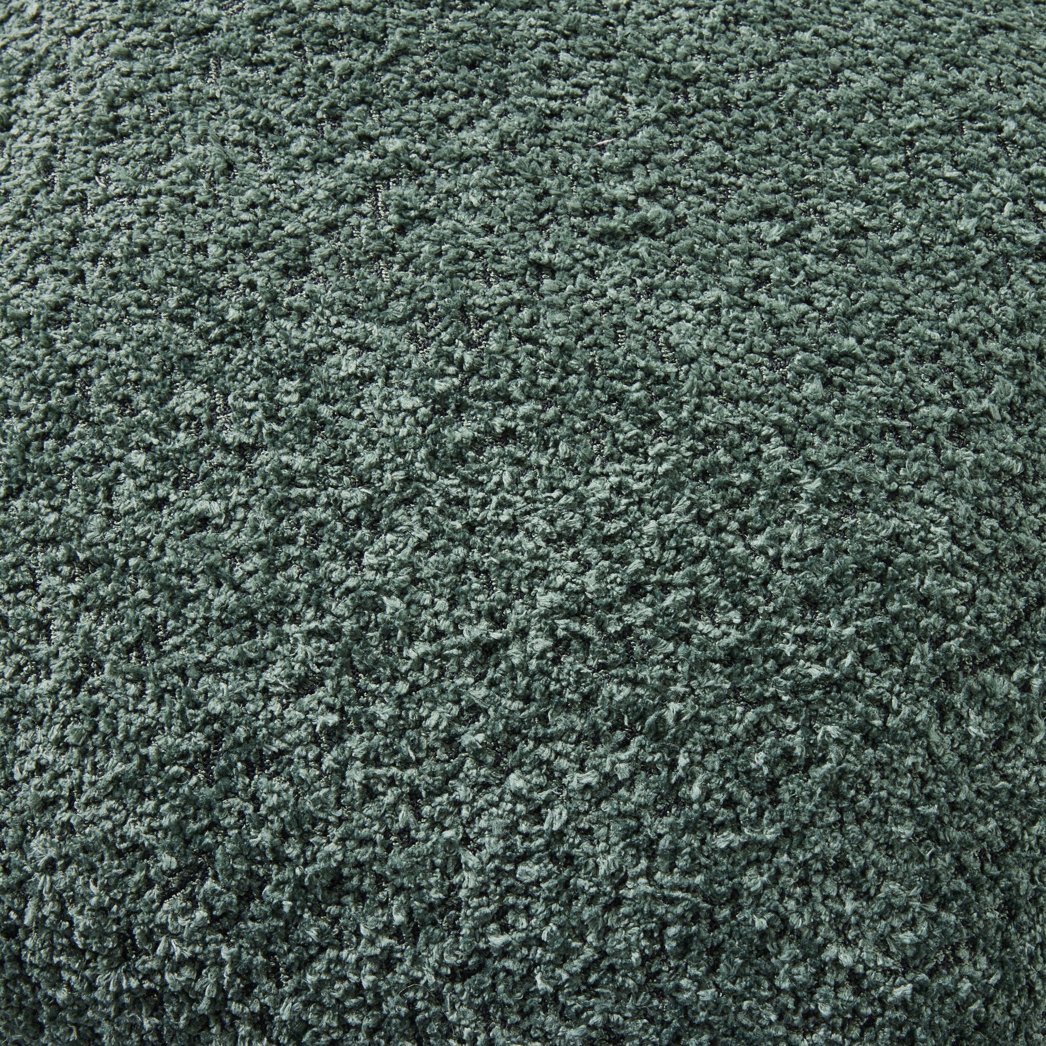 Close-up of the Byron Boucle Cushion Forest 45x45cm, showcasing its forest green textured polyester boucle and soft, irregular pile for a luxe upholstery look.