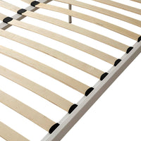 The Maya Queen Bed boasts timber slats set in a metal frame with sleek curved design, connected by sturdy black supports and finished with durable powder coating.