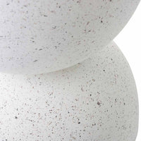 Close-up of two stacked, white, speckled spheres against a plain background, showcasing the modern minimalist Speckle Plant Stand 40x40x45cm.