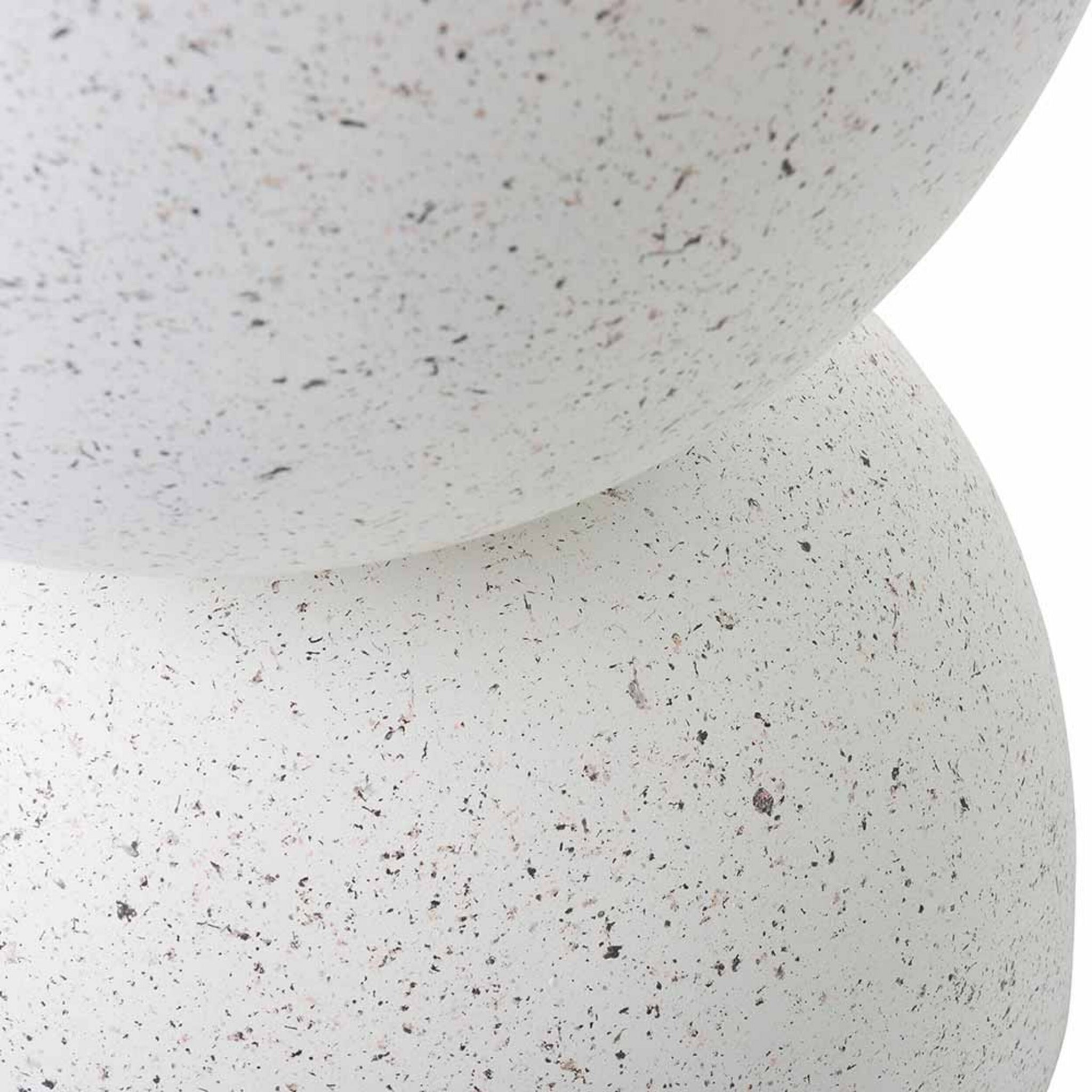Close-up of two stacked, white, speckled spheres against a plain background, showcasing the modern minimalist Speckle Plant Stand 40x40x45cm.