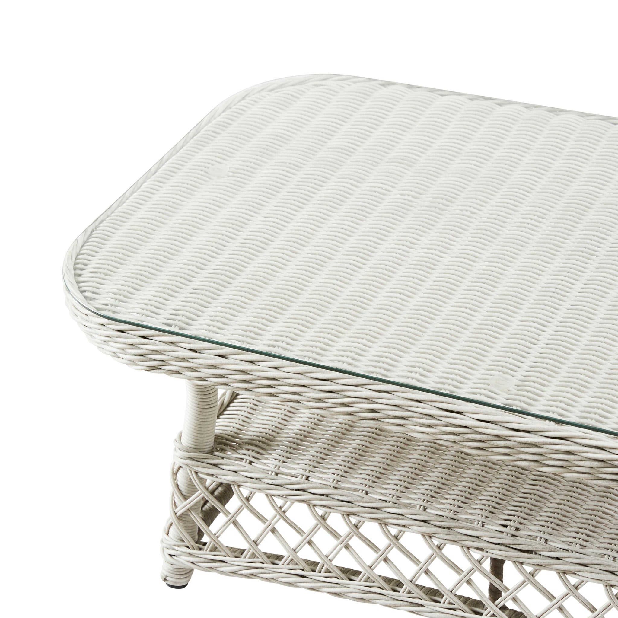 Rectangular white wicker table with glass top and woven lower shelf pairs perfectly with the Catalina 4 Pce Sofa Set, made from all-weather wicker for style and durability in any patio setting.