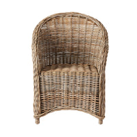 The Martinique Rattan Armchair features a rounded back and woven seat, capturing the tropical beauty of a Caribbean island with its natural rattan style.