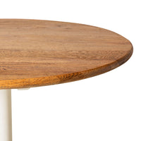 Close-up of the Provincial Oak Drop-Down Cafe Table, featuring a round tabletop with visible grain patterns on a white base.