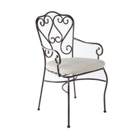 The Manette Outdoor Dining Chair Black M2 features an ornate scrollwork backrest, armrests, a white cushioned seat, and a durable powder-coated finish in French Provincial design, shown on a white background.