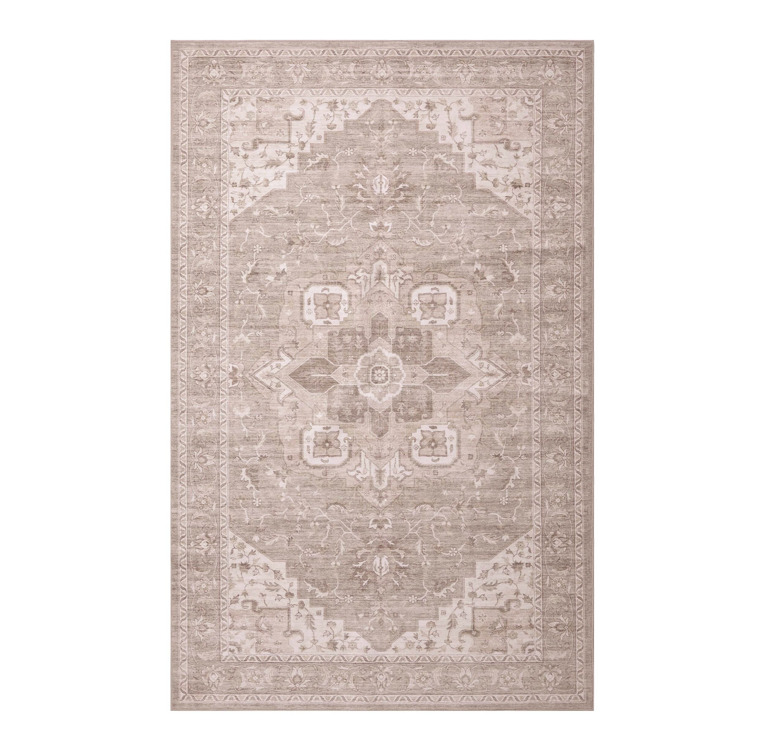The Manisa Washable Rug 240x300cm features a rectangular Persian-inspired design with a faded floral and geometric pattern in beige, cream, and blue-green. Made from durable, machine-washable polyester for easy care.