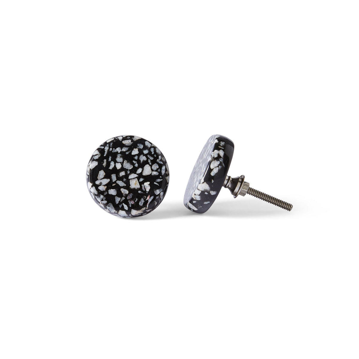 The Speckle Black and White Knob 4.4cm earrings feature a round design with a black base and white speckled terrazzo-like pattern; one earring is flat, the other upright to display the metal post.
