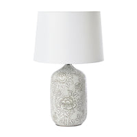 The Natural Hues Floral Table Lamp 61cm features a porcelain base with an elegant floral design in soft gray and comes with a white shade.