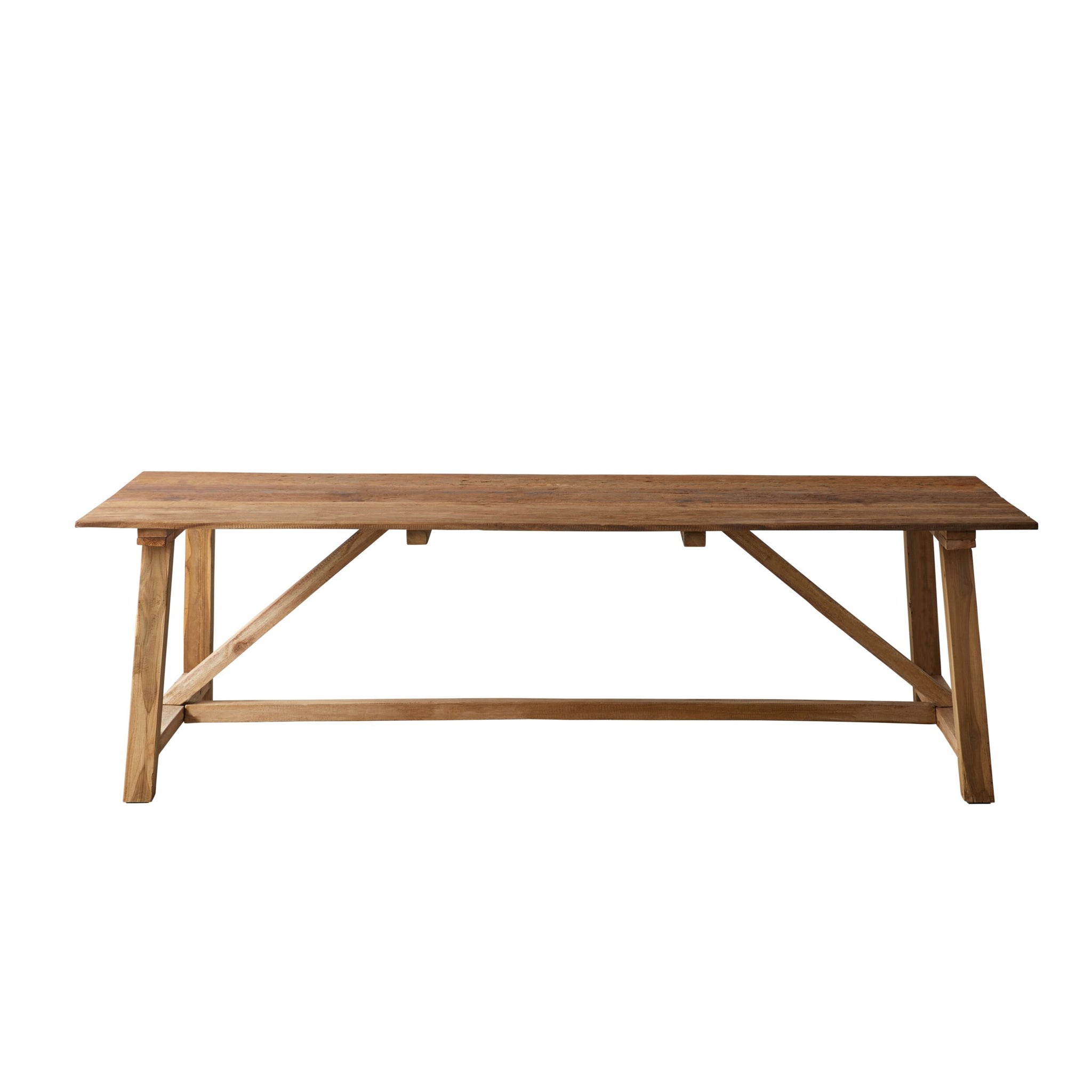 Wide shot of wooden dining table with matching stools in a kitchen-like setting