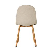 The image displays the back of the Knox Dining Chair Stone, a beige upholstered bucket seat with wooden legs, set against a plain white background—ideal for a coastal home.