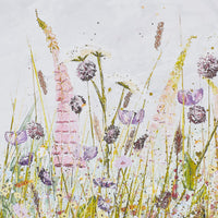 The Arthouse Foxglove Haven Framed Print (100x50cm) features wildflowers and grasses in soft pastels on a white background, with light splatters and texture—ideal for adding serenity to a modern space.