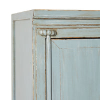 Close-up of a vintage light teal cabinet corner, crafted from recycled pine wood with decorative trim and a slightly distressed finish. Product: Sansha Wedding Cabinet Dove Grey.