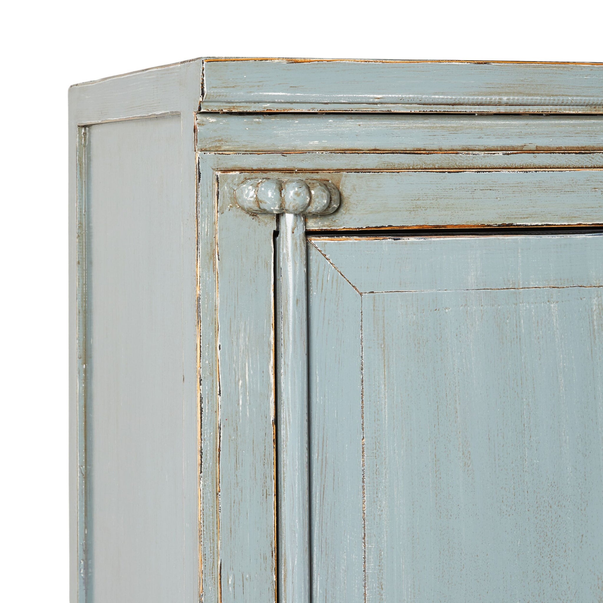 Close-up of a vintage light teal cabinet corner, crafted from recycled pine wood with decorative trim and a slightly distressed finish. Product: Sansha Wedding Cabinet Dove Grey.