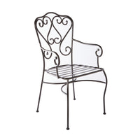 The Manette Outdoor Dining Chair Black M2 features a black metal frame, curved decorative backrest, armrests, and a durable powder-coated finish. Shown on a white background, it adds French Provincial charm to your outdoor space.