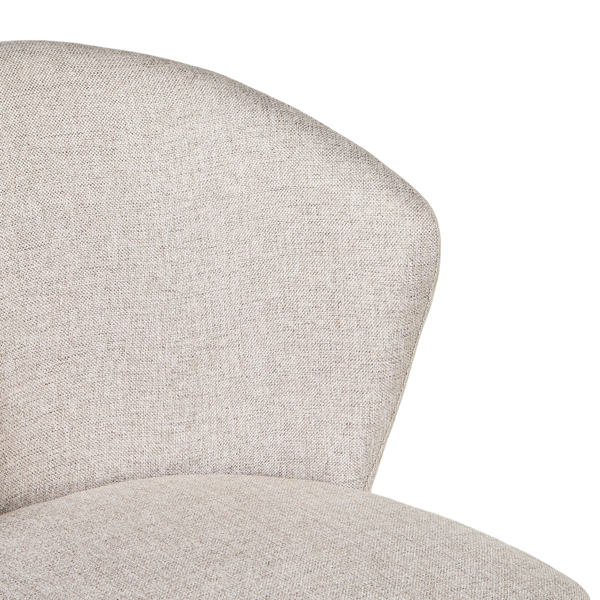 Close-up of the Cole Dining Chair Clay's curved, padded backrest and seat, upholstered in light beige textured fabric—ideal for a modern living style.