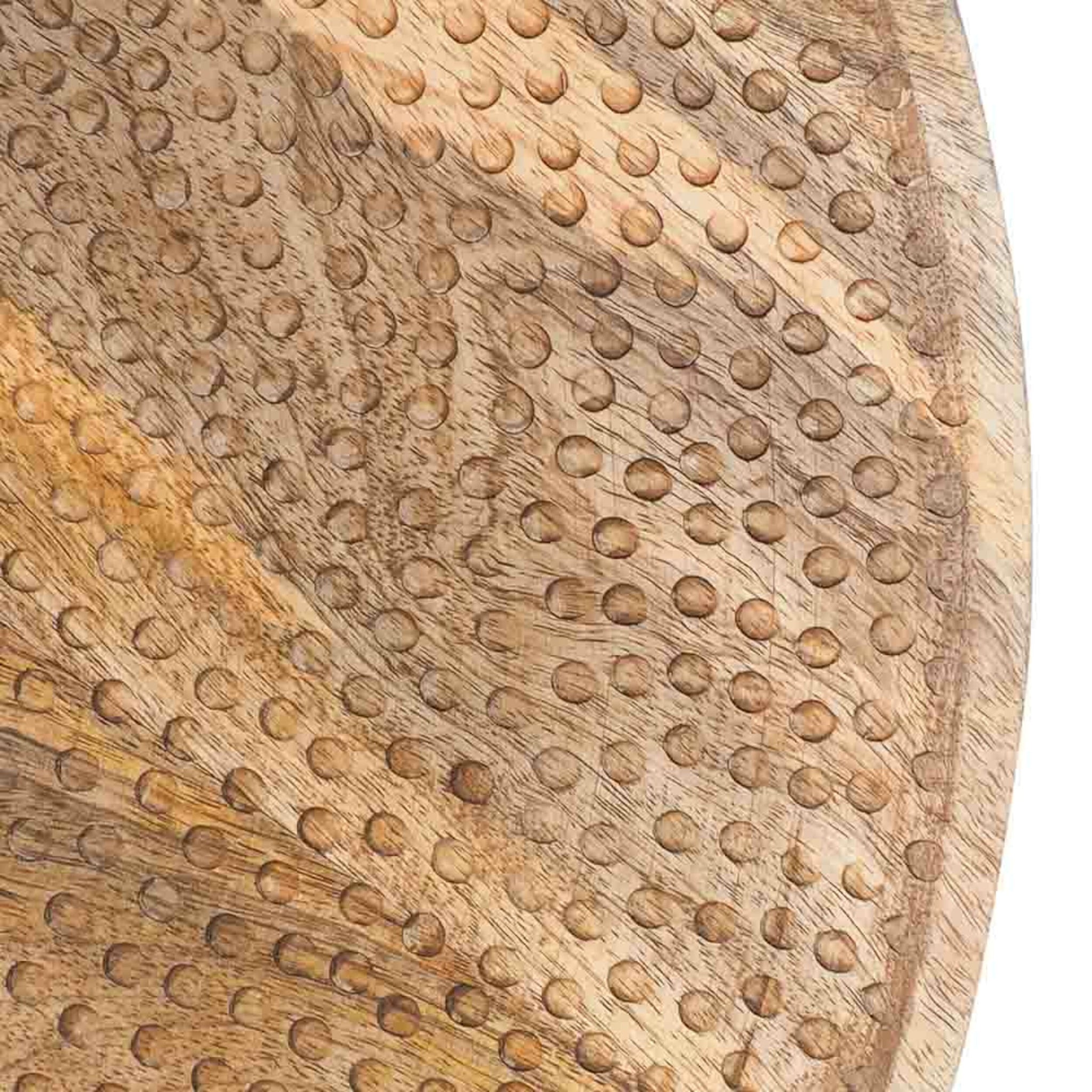 A close-up of the Arlo Lazy Susan 45x5cm features a mango wood surface with a carved dot pattern, perfect for adding elegance to any table setting.