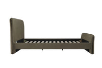 Side view of the Audrey King Bed in luxurious moss green velvet, showcasing its padded headboard and footboard against a crisp white background.