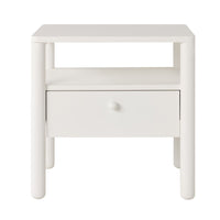 The Spintara 1 Drawer Bedside Table White features a minimalist coastal country style with rounded legs, one open shelf, and a single drawer—perfect as a stylish and functional addition to your bedroom.