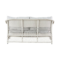 Back view of the Catalina 4 Pce Sofa Set, showcasing a white all-weather wicker design with light gray moisture-resistant cushions and a crisscross pattern on the backrest.