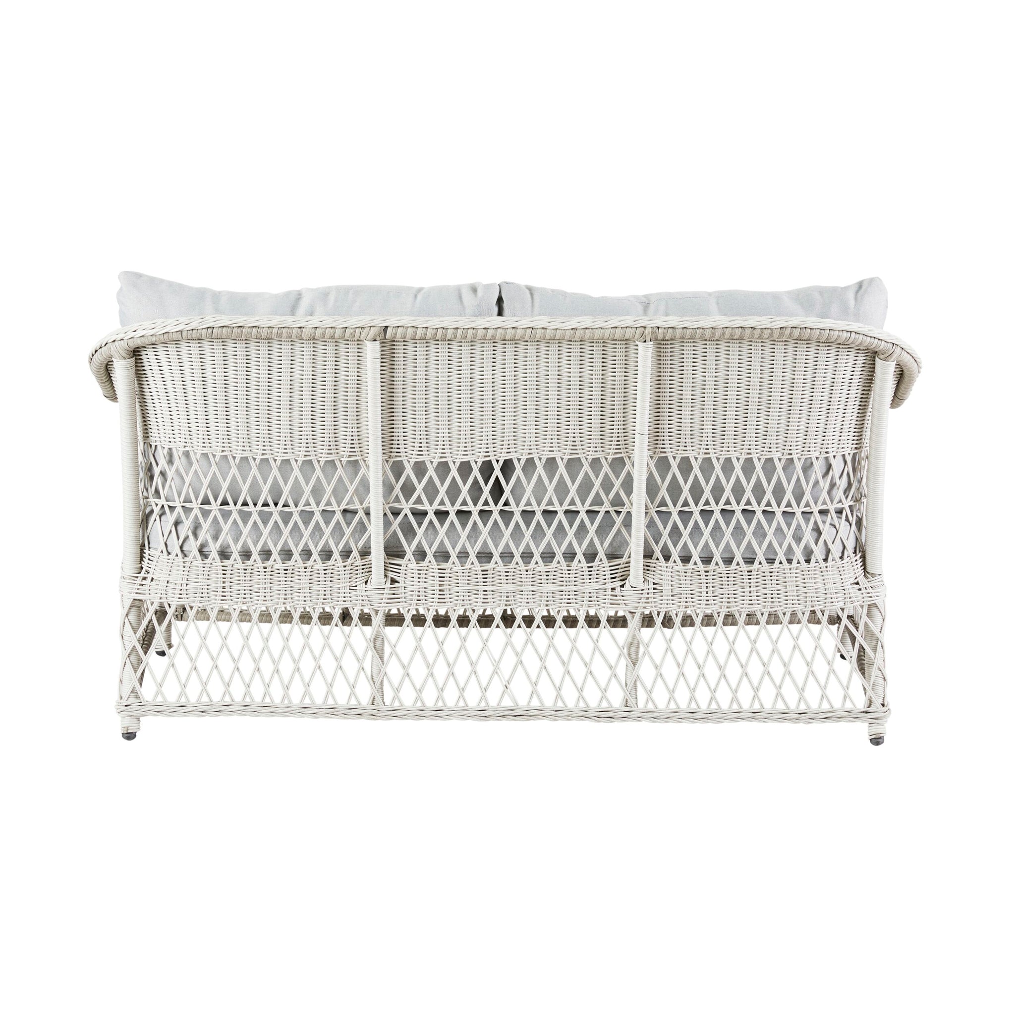 Back view of the Catalina 4 Pce Sofa Set, showcasing a white all-weather wicker design with light gray moisture-resistant cushions and a crisscross pattern on the backrest.