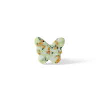 The Speckle Green Butterfly Knob 3.7cm features a butterfly shape with a light green base and multicolored speckles—an ideal decorative drawer pull for any space. Displayed against a white background.