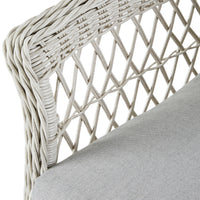 Close-up of the Catalina 4 Piece Sofa Set's wicker chair featuring a crisscross design and moisture-resistant cushions. The light gray seat enhances the all-weather wicker, ensuring durability and style for outdoor use.