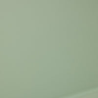 The Cambell Aluminium Table in Native Green features a smooth, light powder-coated surface with a subtle texture.