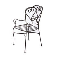 The Manette Outdoor Dining Chair Black M2 features decorative scrollwork on the backrest and armrests, a durable powder-coated finish, and is shown angled away.