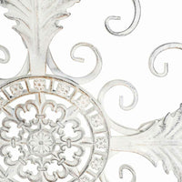 The Swirl Wall Hanging (93x1x93cm) features an intricate antique white wrought iron design with floral and leaf patterns, perfect for adding elegance to any space.