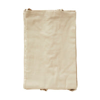 A folded beige fabric bag with handles, set against a white background, evokes the soft neutral tones of the Hampton Cotton Voile Curtain - Set of 6.