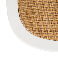 Close-up of a woven rattan texture framed with a crisp white wooden border, reminiscent of the Provincial Cross Back Dining Chair's Parisian chic style.